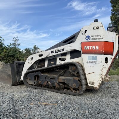 Mini bobcat loader with beautiful blue sky